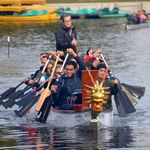 People rowing dragon boat